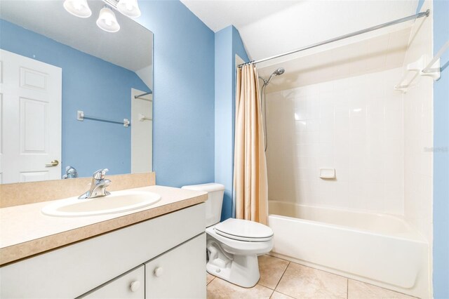 full bathroom with tile patterned flooring, vanity, shower / bath combination with curtain, and toilet