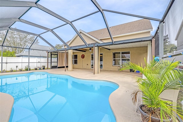 view of swimming pool featuring a lanai and a patio area