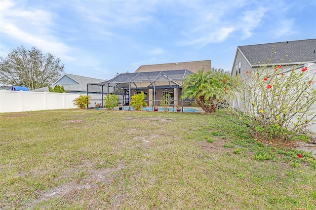 view of yard featuring a fenced in pool and a lanai