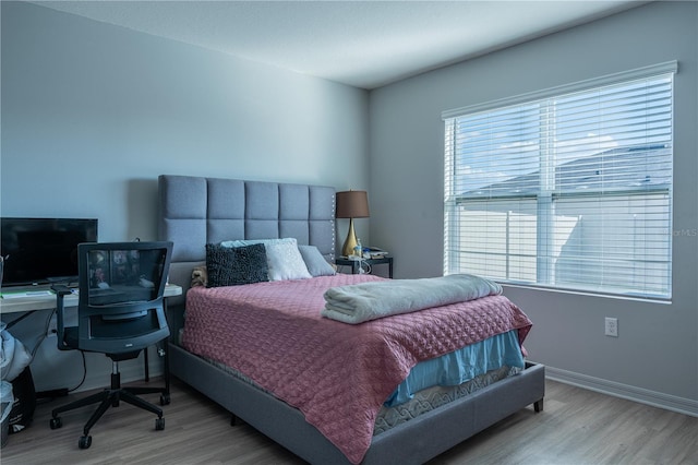 bedroom featuring light wood-type flooring