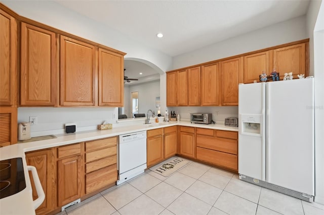 kitchen featuring ceiling fan, white appliances, sink, and light tile patterned floors