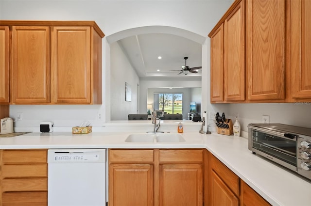 kitchen featuring ceiling fan, sink, and white dishwasher