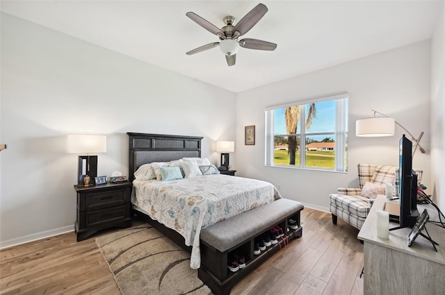 bedroom featuring hardwood / wood-style flooring and ceiling fan