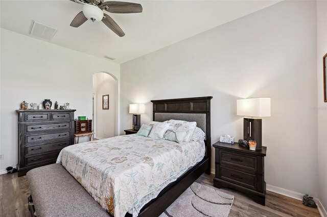 bedroom featuring ceiling fan and dark hardwood / wood-style floors