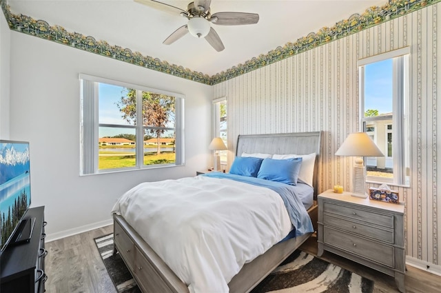 bedroom featuring hardwood / wood-style flooring and ceiling fan