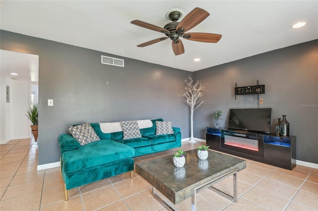 living area with visible vents, baseboards, recessed lighting, light tile patterned flooring, and a ceiling fan