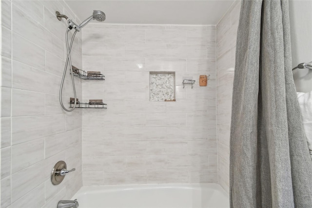 bathroom with shower / bath combo with shower curtain