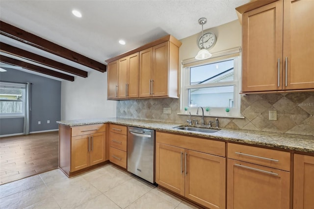 kitchen featuring sink, light stone counters, decorative light fixtures, dishwasher, and beam ceiling