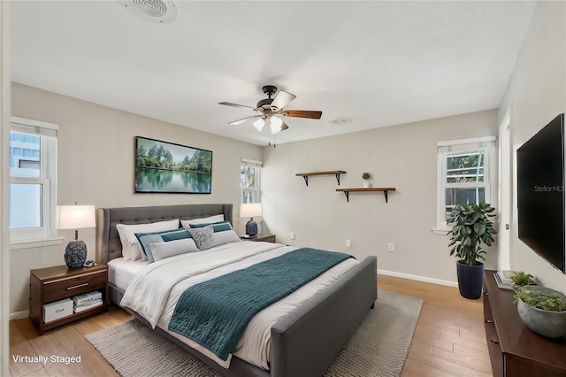 bedroom featuring ceiling fan and light hardwood / wood-style floors