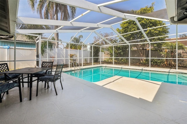 view of pool featuring a patio and glass enclosure