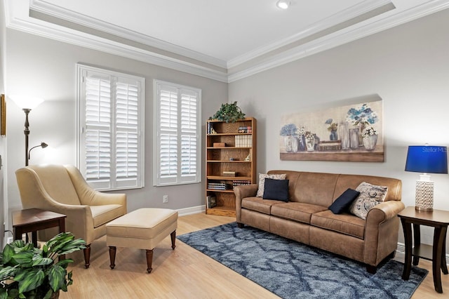 living room with ornamental molding and light wood-type flooring