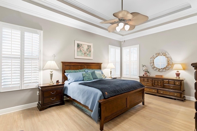 bedroom with ceiling fan, ornamental molding, and light hardwood / wood-style floors