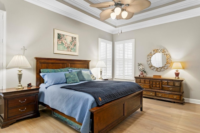 bedroom with ceiling fan, ornamental molding, and light wood-type flooring