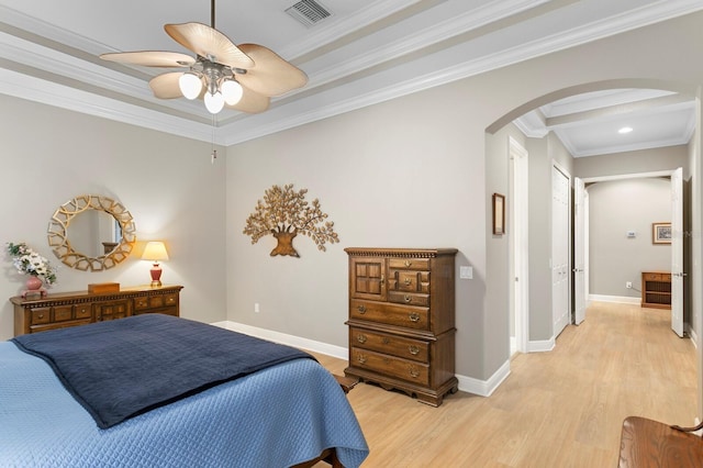 bedroom with crown molding, light hardwood / wood-style flooring, and ceiling fan