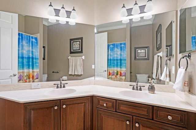 bathroom featuring vanity, crown molding, curtained shower, and toilet