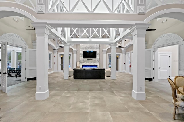 entrance foyer featuring decorative columns and a high ceiling