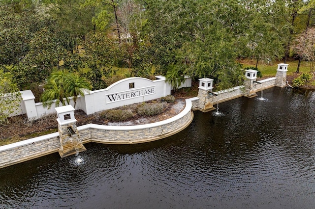 community sign with a water view