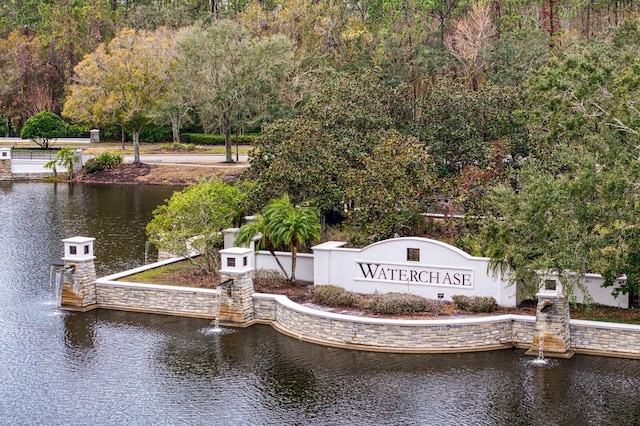 community sign with a water view