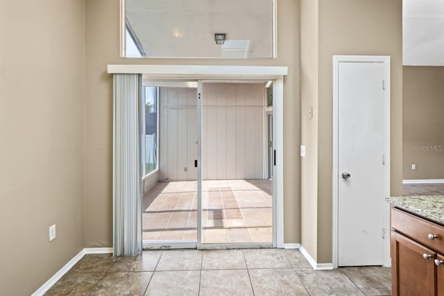 interior space with light tile patterned floors and a wealth of natural light