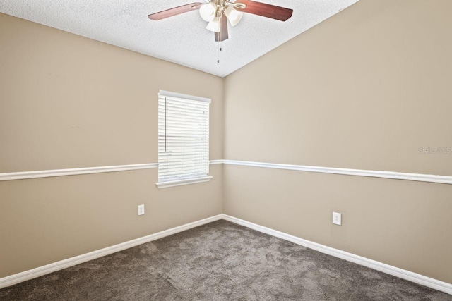 unfurnished room featuring vaulted ceiling, carpet, ceiling fan, and a textured ceiling