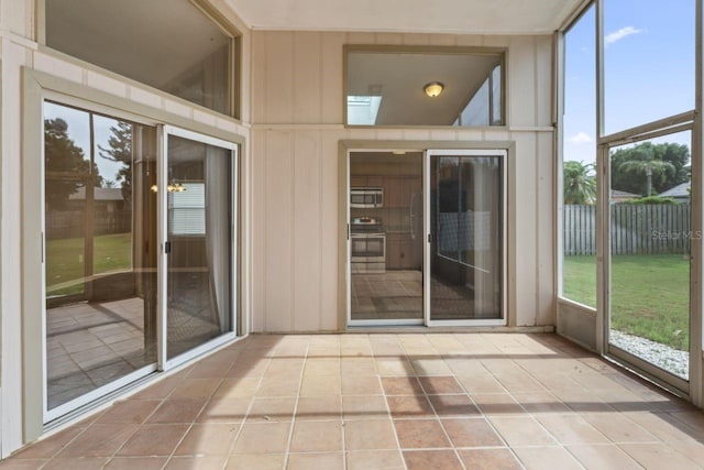 unfurnished sunroom featuring plenty of natural light