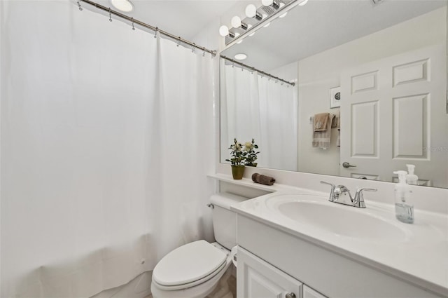 full bathroom featuring shower / bathtub combination with curtain, vanity, and toilet