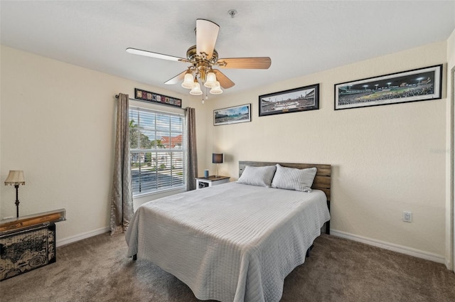 bedroom featuring dark carpet and ceiling fan