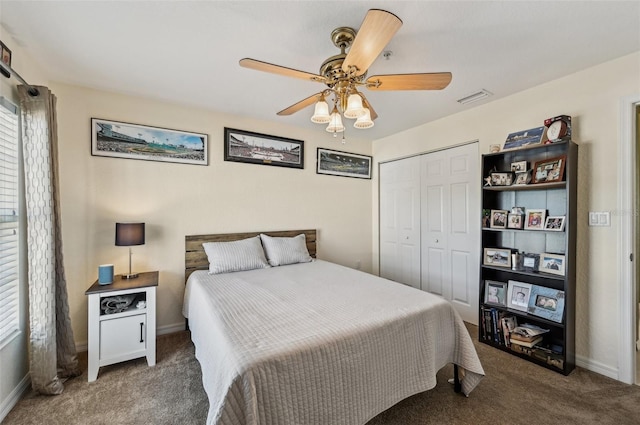 carpeted bedroom with a closet and ceiling fan