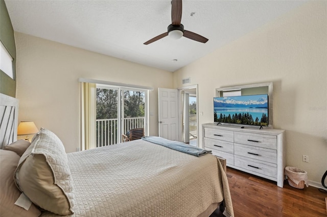 bedroom featuring ceiling fan, dark hardwood / wood-style flooring, vaulted ceiling, and access to outside