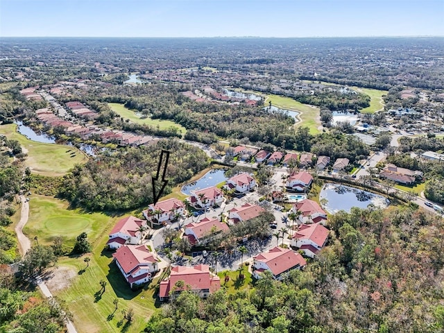 drone / aerial view with a water view