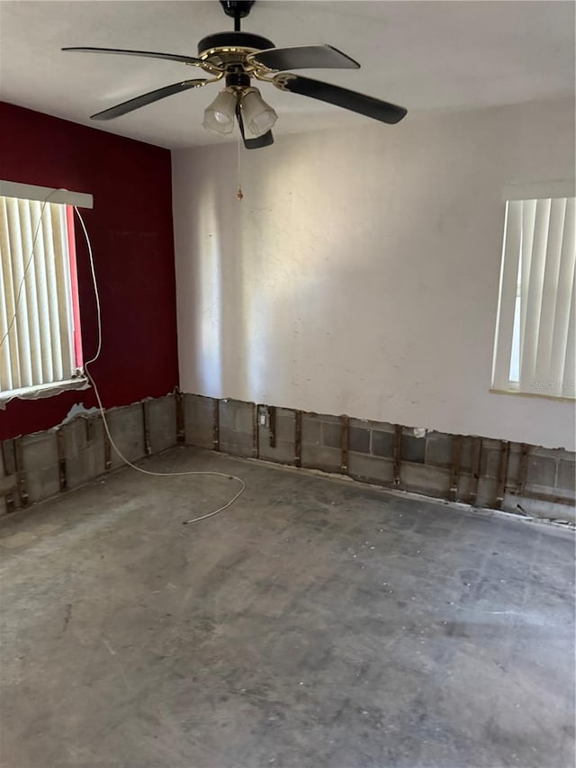 unfurnished room featuring concrete floors