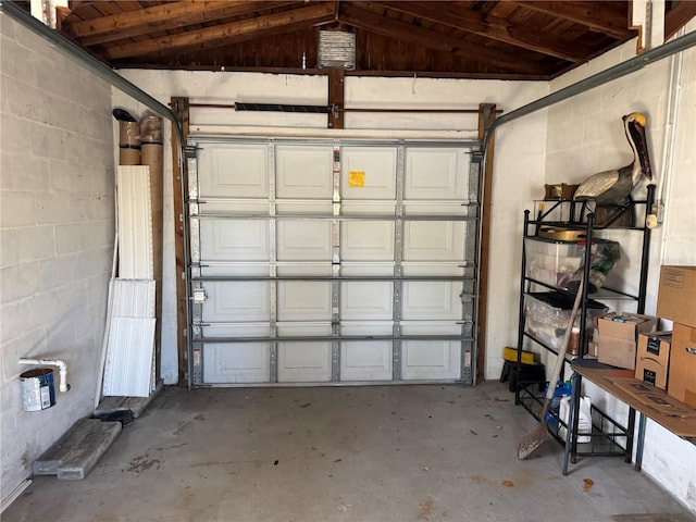 garage with concrete block wall