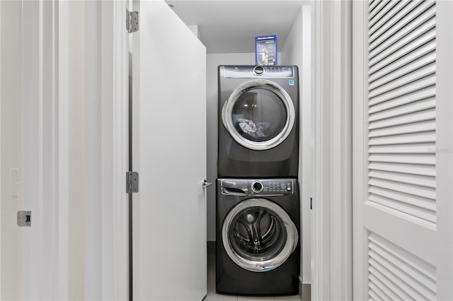 washroom with stacked washer / dryer