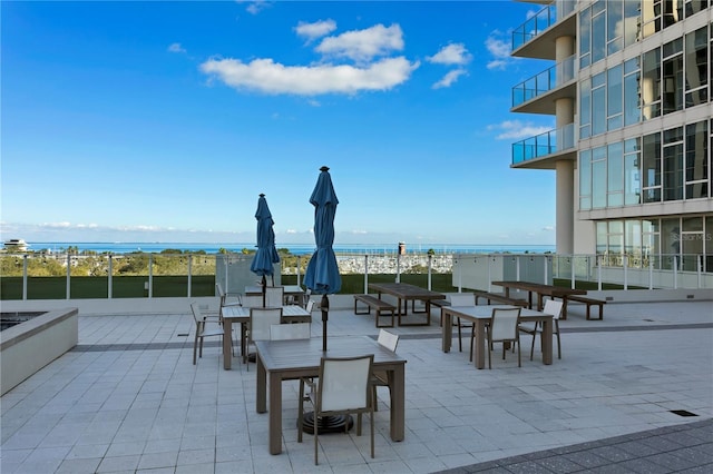 view of patio / terrace with a water view