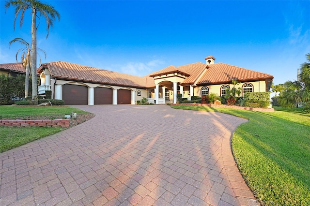 2186 Rockledge Dr, Rockledge, FL 32955 - mediterranean / spanish house with a garage and a front lawn