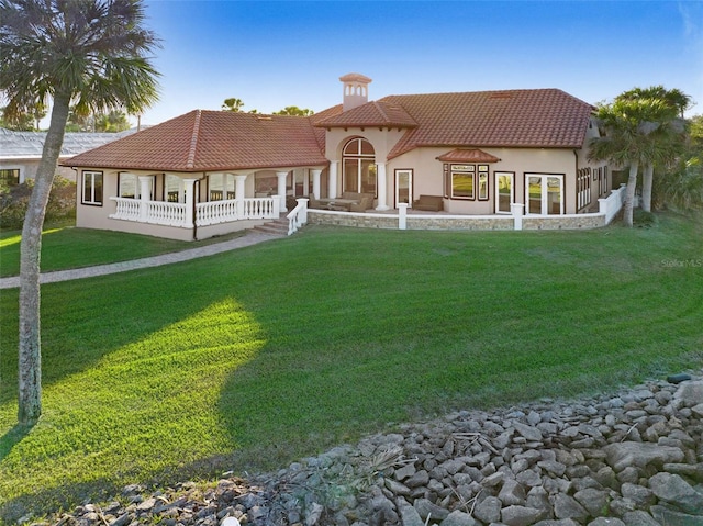 2186 Rockledge Dr, Rockledge, FL 32955 - rear view of house featuring a lawn