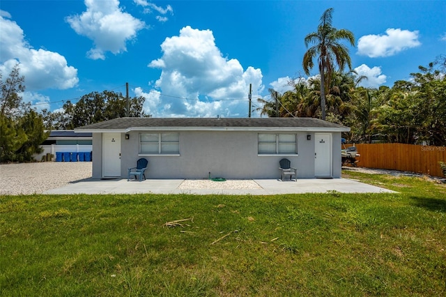 8820 Rocky Creek Dr, Tampa, FL 33615 - rear view of property with a patio and a yard