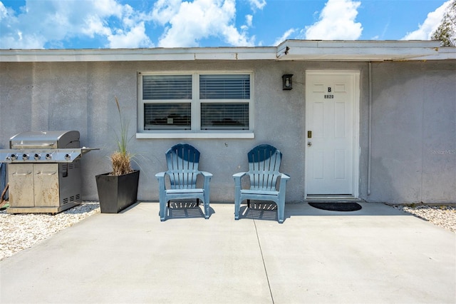 8820 Rocky Creek Dr, Tampa, FL 33615 - doorway to property featuring a patio area