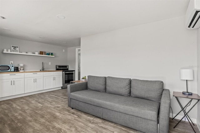 8820 Rocky Creek Dr, Tampa, FL 33615 - living room featuring wet bar, wood-type flooring, and a wall mounted air conditioner