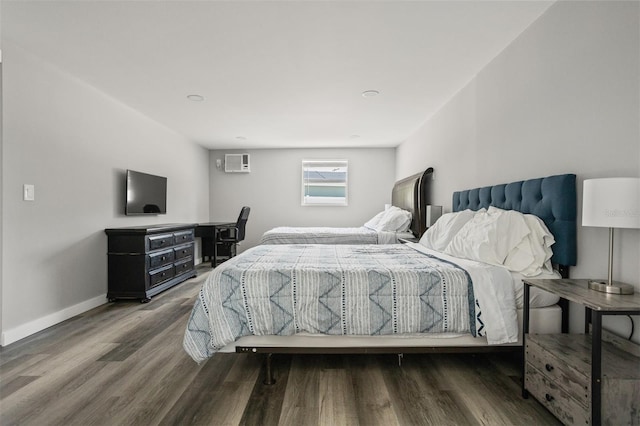 8820 Rocky Creek Dr, Tampa, FL 33615 - bedroom featuring dark hardwood / wood-style flooring and an AC wall unit