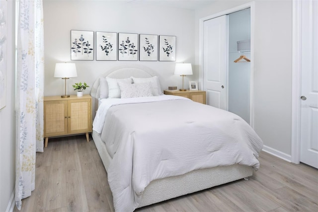 bedroom with a closet and light wood-type flooring