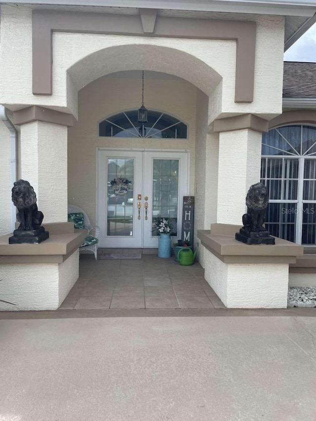 entrance to property featuring french doors