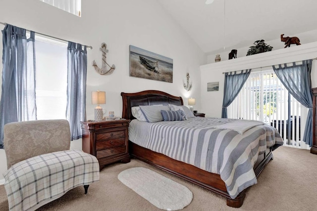 bedroom featuring high vaulted ceiling and carpet