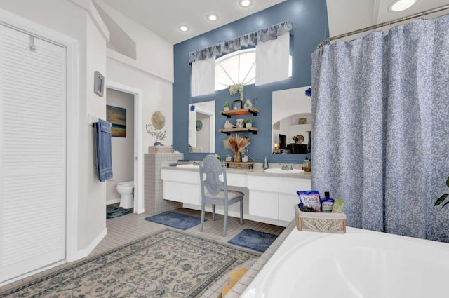 full bath featuring tile patterned flooring, toilet, recessed lighting, vanity, and a bath