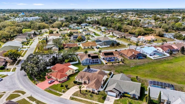 birds eye view of property with a residential view