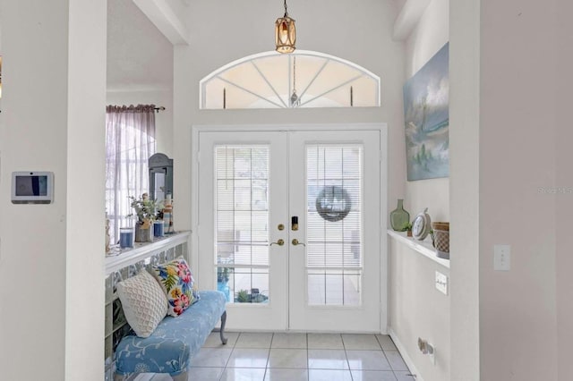 doorway featuring tile patterned flooring and french doors