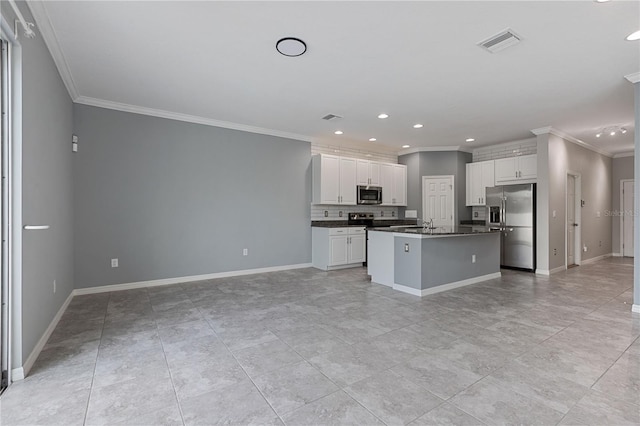 kitchen with stainless steel appliances, an island with sink, crown molding, and white cabinetry