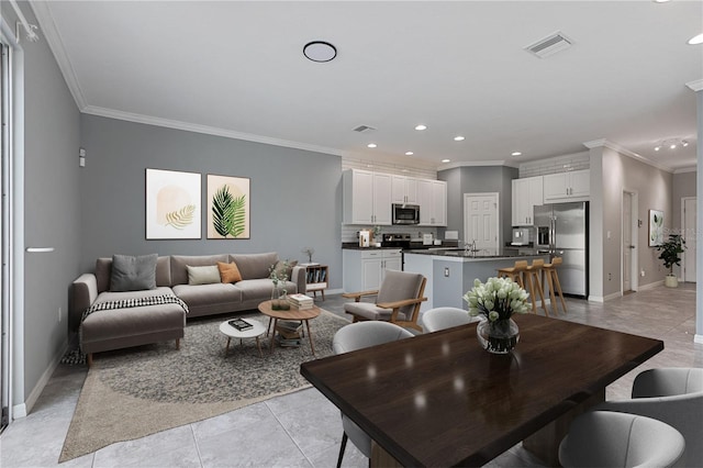 living room featuring crown molding