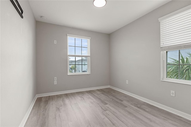 unfurnished room featuring light hardwood / wood-style floors