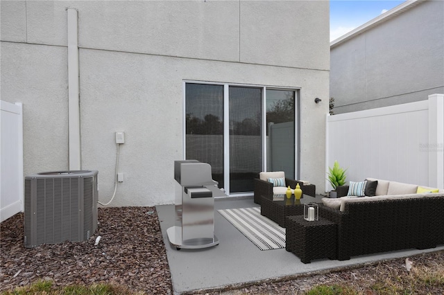 view of patio / terrace with an outdoor living space and central air condition unit